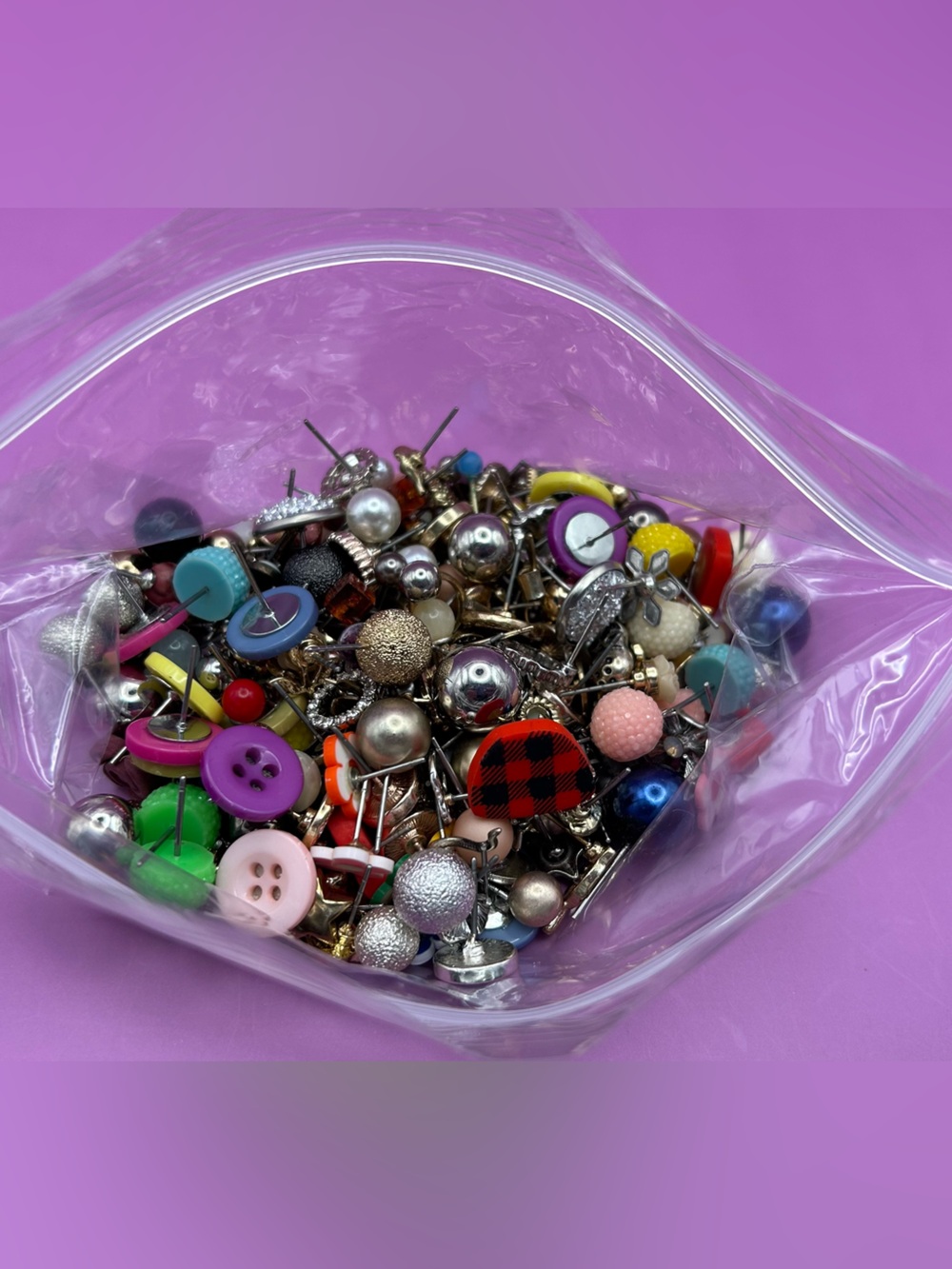 5 oz bag of post-back single earrings for crafting. No backings . Various types